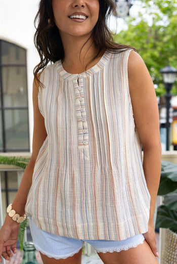 Women Wearing a stripe shirt with denim shorts outside 