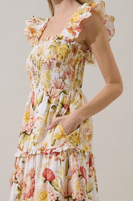 Woman wearing a floral dress with a neutral background
