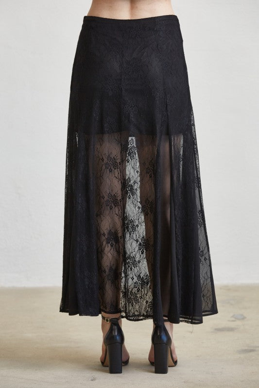 Black lace skirt with sheer panels on a plain background