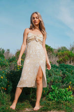 golden midi dress in field 