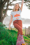 girl wearing boho pants and graphic tee in Carmel California