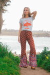 girl wearing boho pants and graphic tee in Carmel California