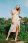 golden midi dress in field 