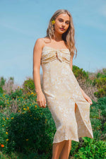 golden midi dress in field 