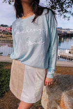 woman in skirt and sweater near Fishermans wharf in Monterey California 