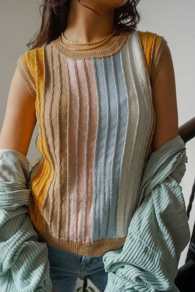 woman in colorful vest with glitter seams